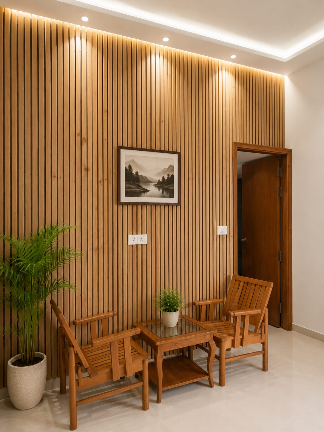 Wood-slat feature wall with framed mountain artwork and lounge chairs